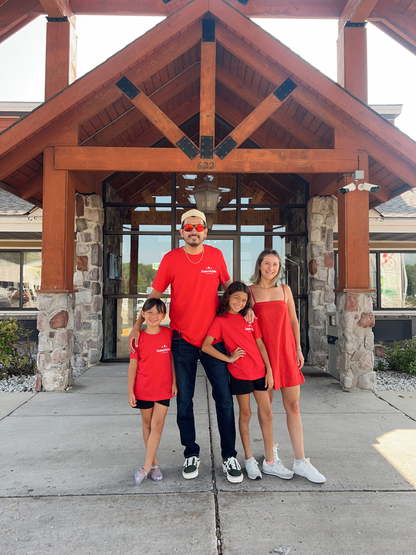 family outside of hotel